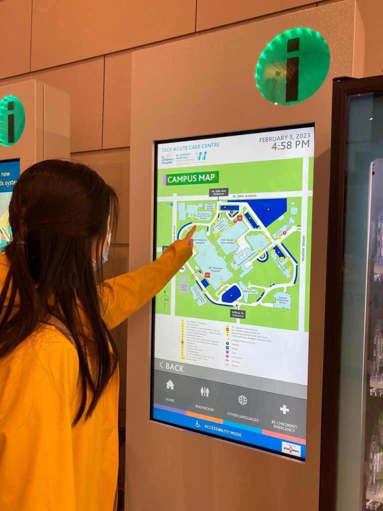 Jancis using an informational kiosk at BC Children's Hospital